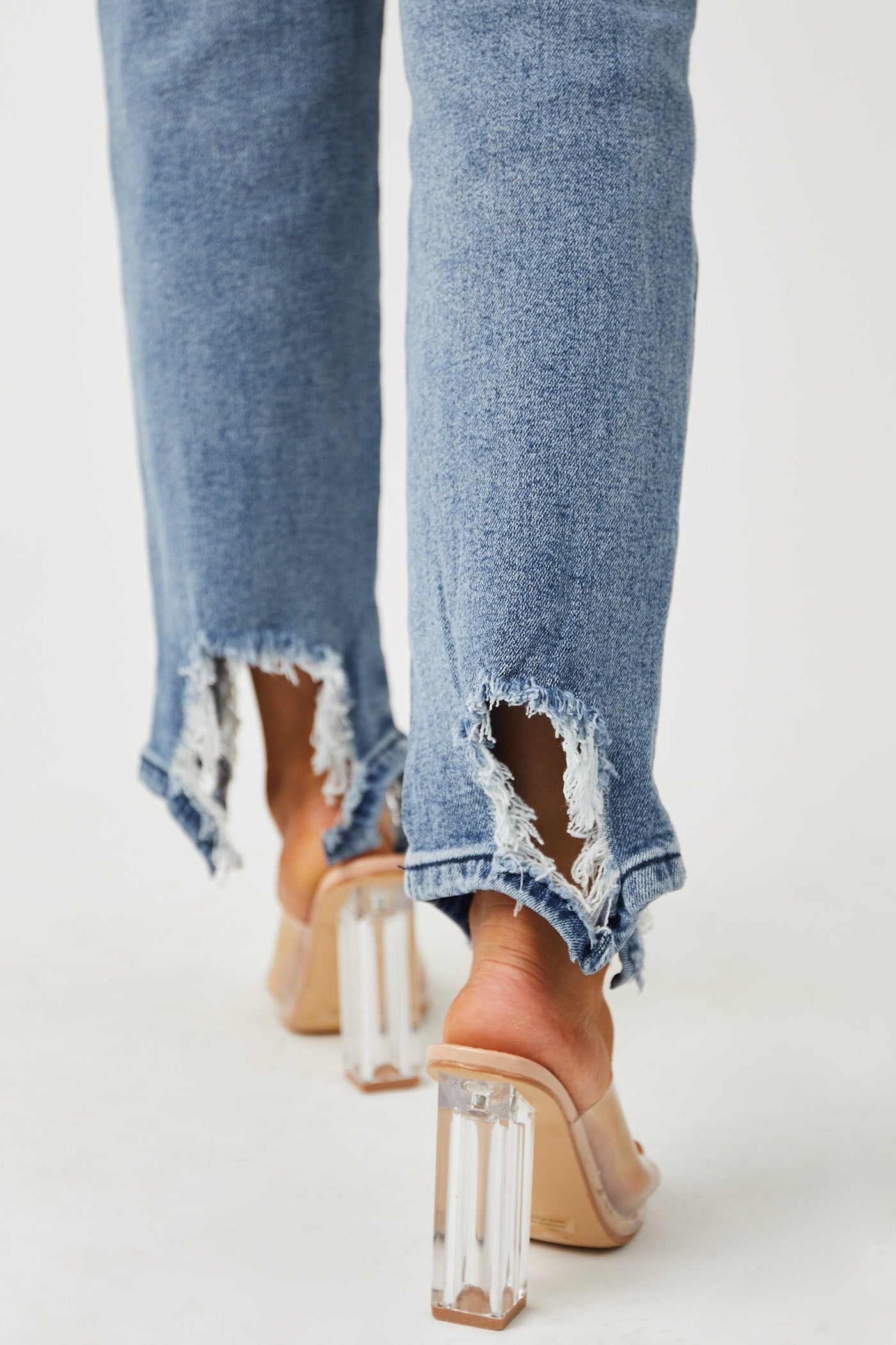 Medium Acid Wash Shark Bite Distressed Hem Jeans