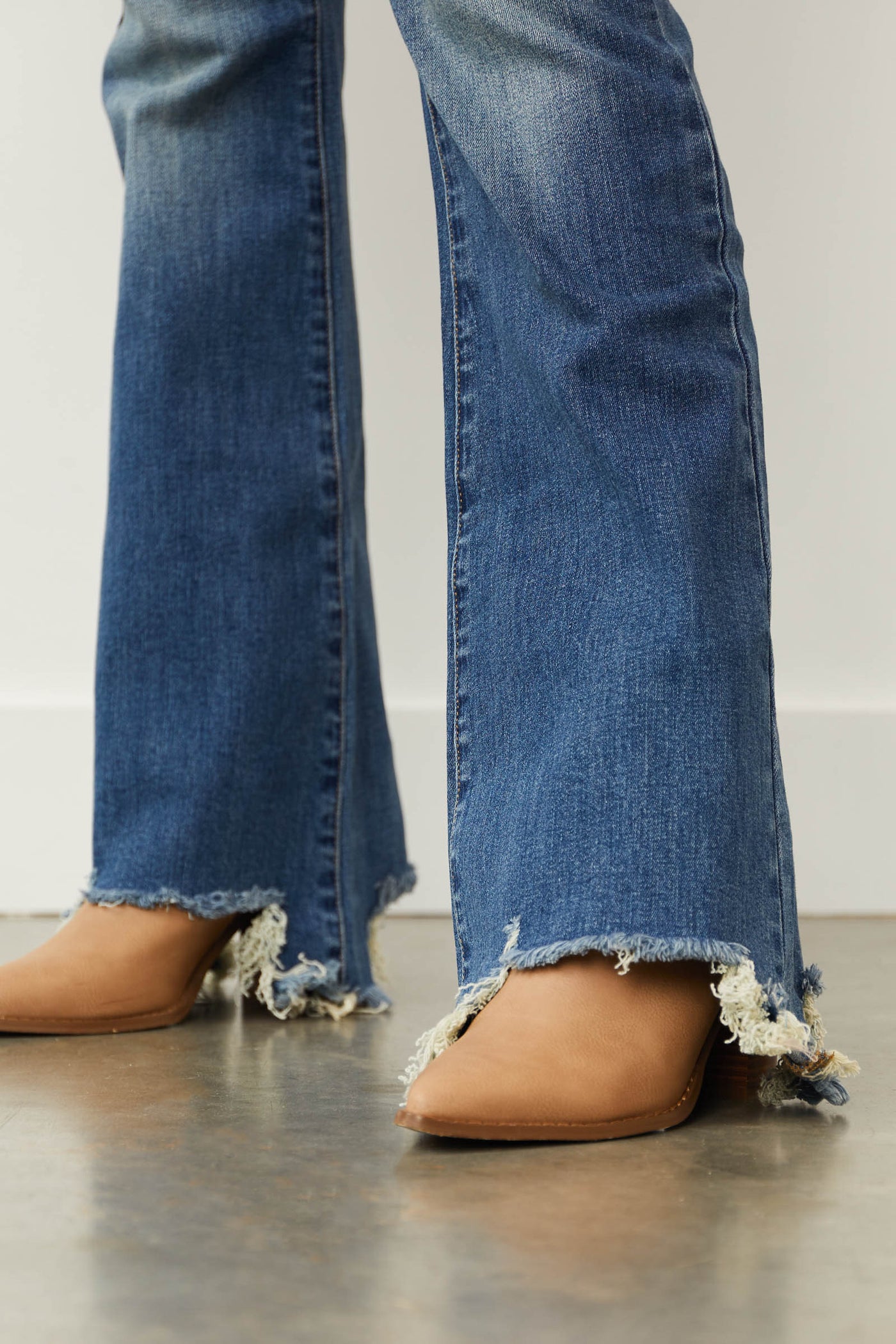 Medium Mid Rise Distressed Flared Jeans