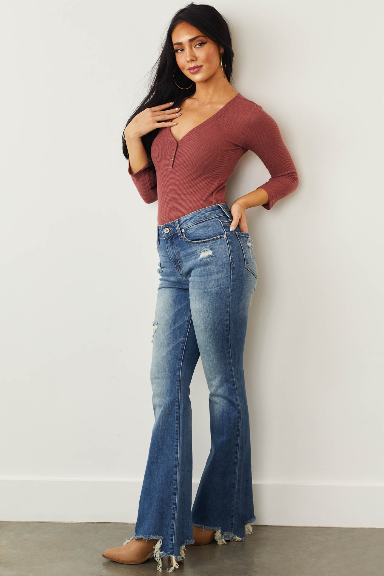 Medium Mid Rise Distressed Flared Jeans