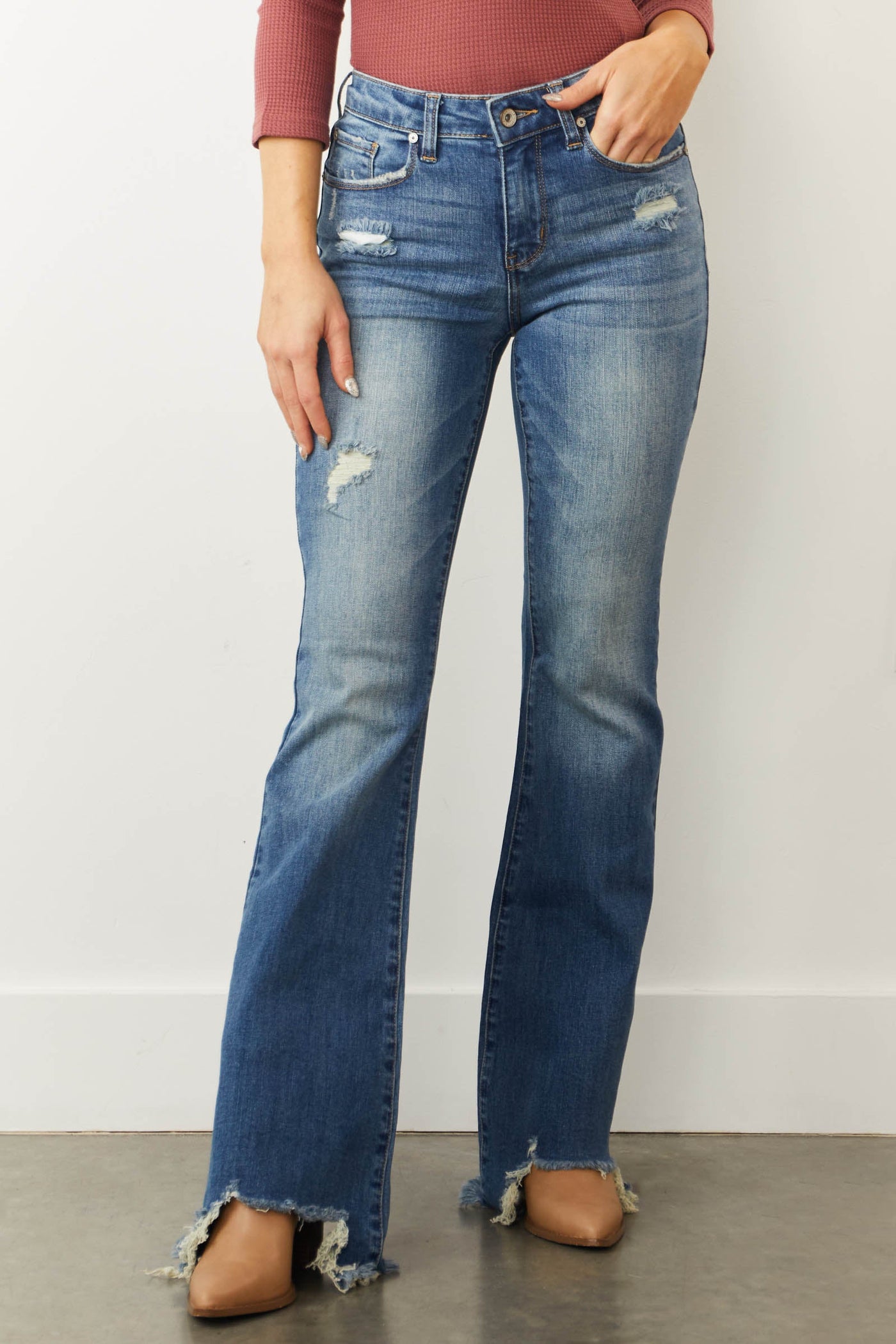 Medium Mid Rise Distressed Flared Jeans