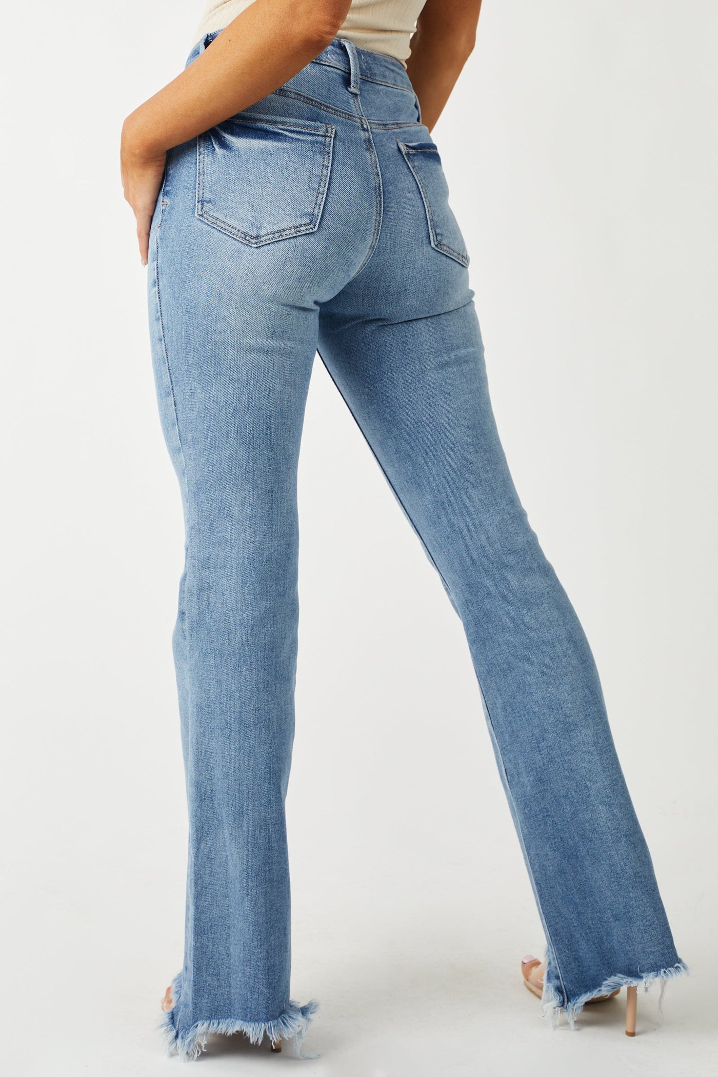 Medium Wash High Rise Raw Hem Bootleg Jeans