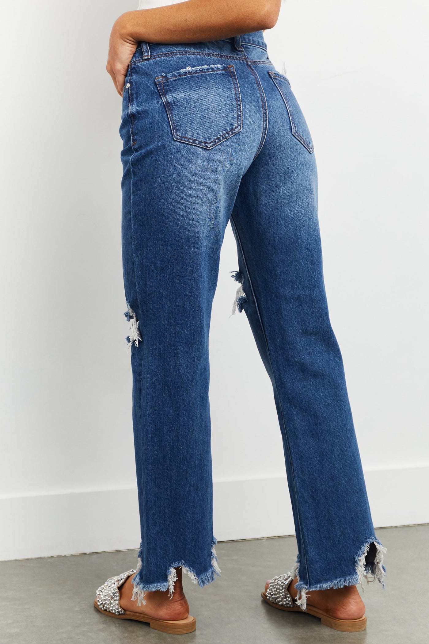 Medium Washed Shark Bite Hem Distressed Jeans