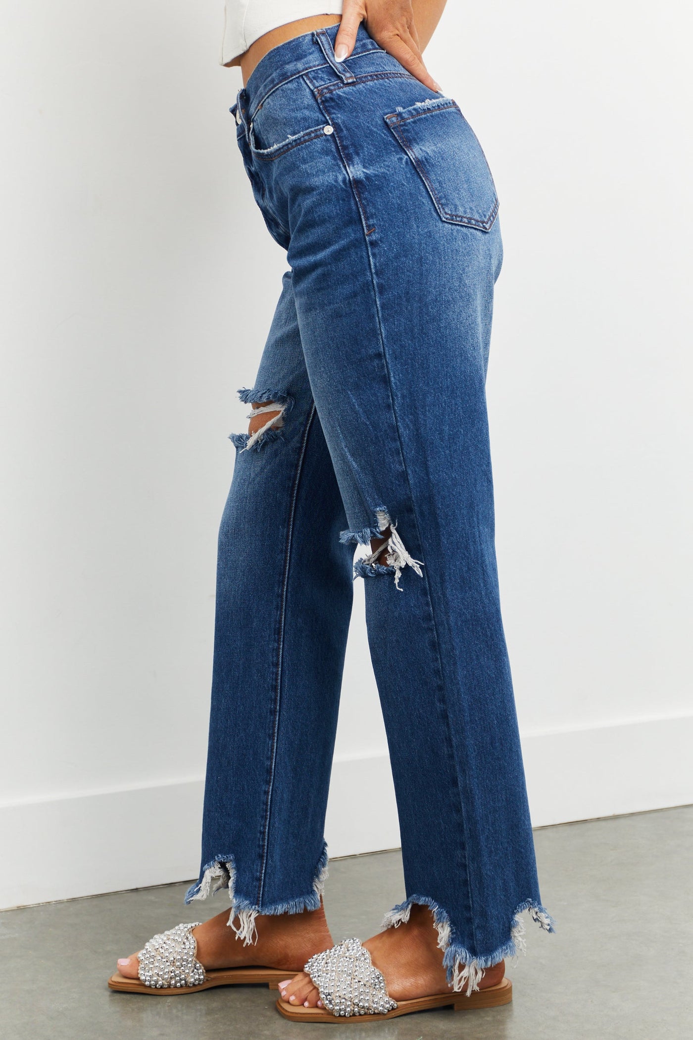 Medium Washed Shark Bite Hem Distressed Jeans