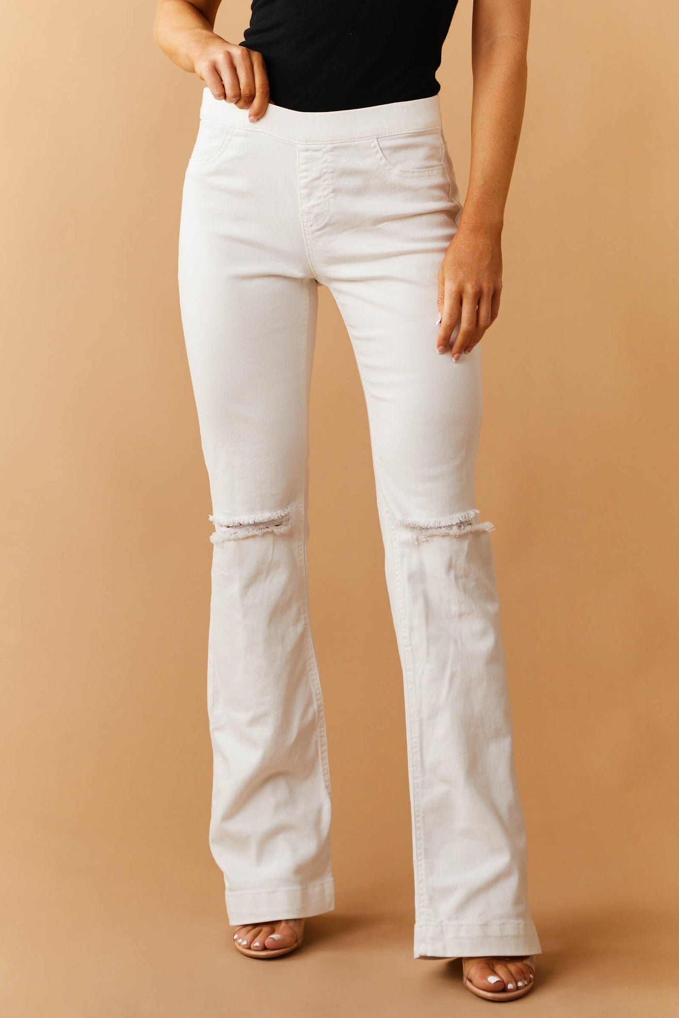 Off White Mid Rise Distressed Knee Jeggings
