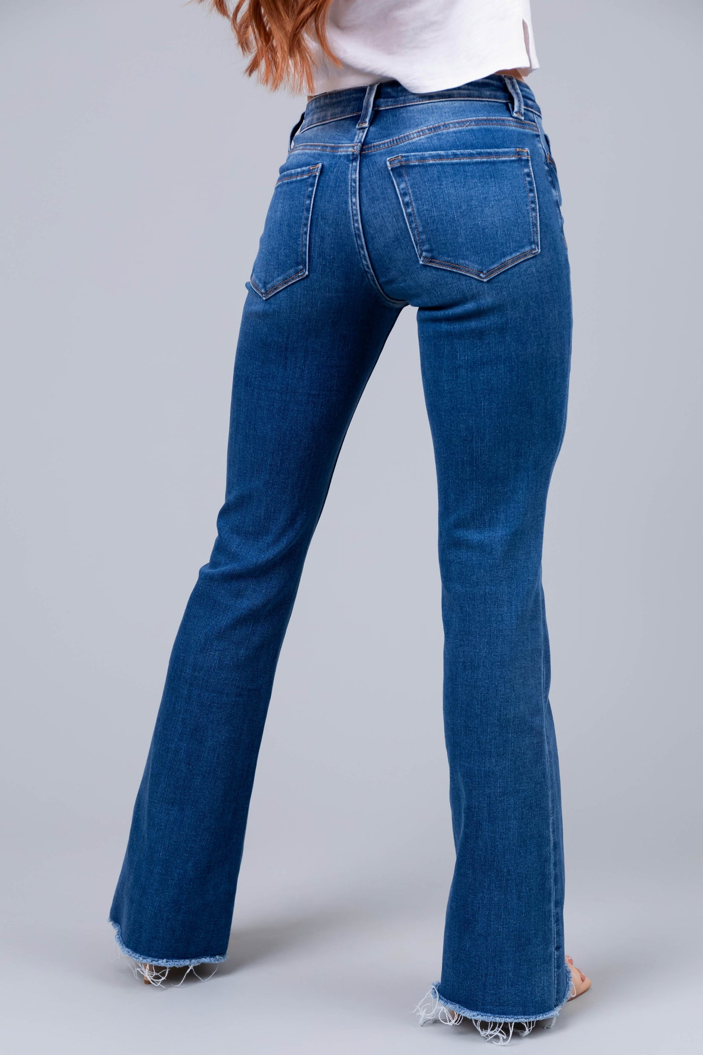 Vervet Medium Wash Mid Rise Raw Hem Jeans