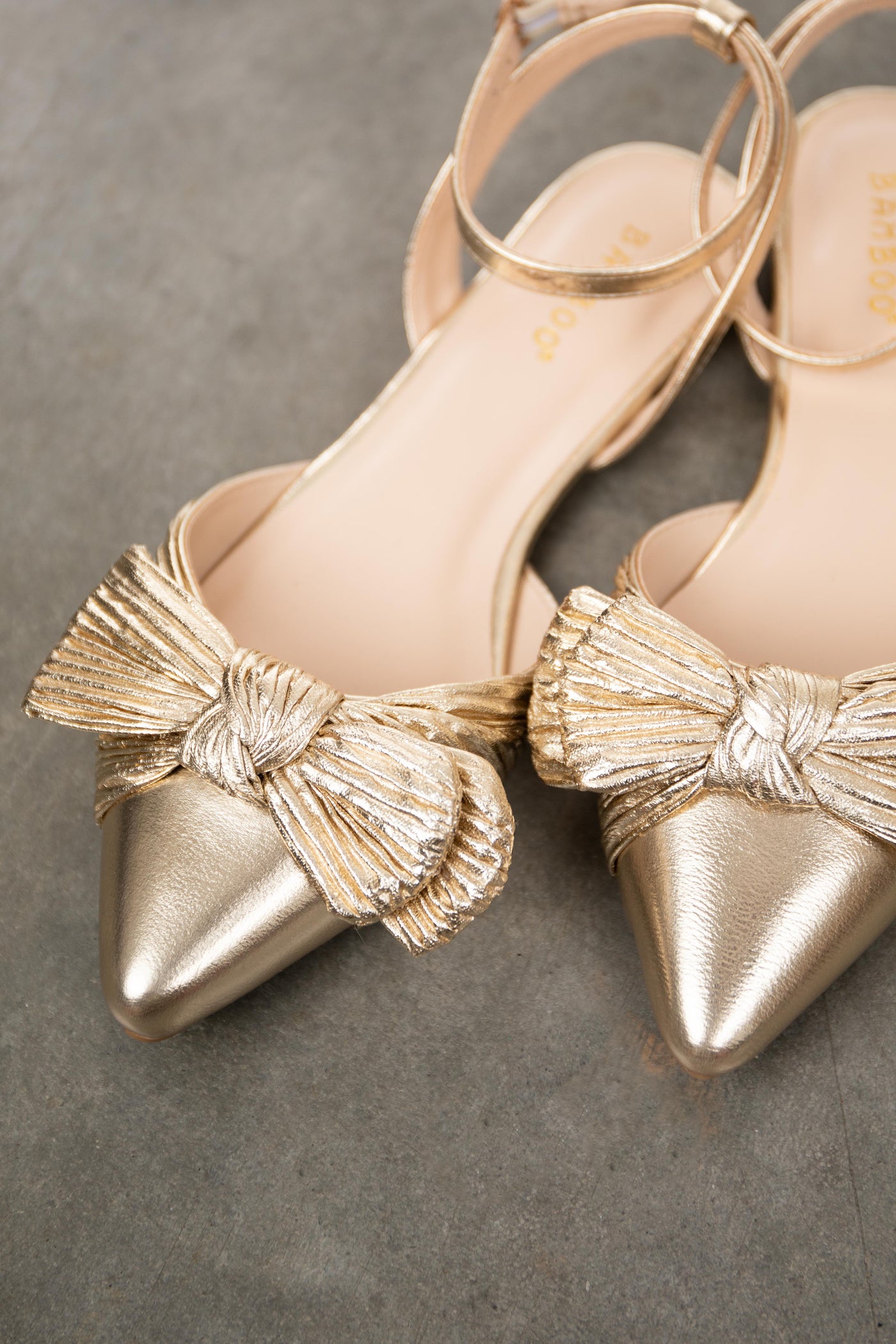 Gold Metallic Pointed Toe Flats with Bow Detail