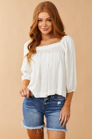Ivory Half Length Bubble Sleeve Blouse with High Low Hemline