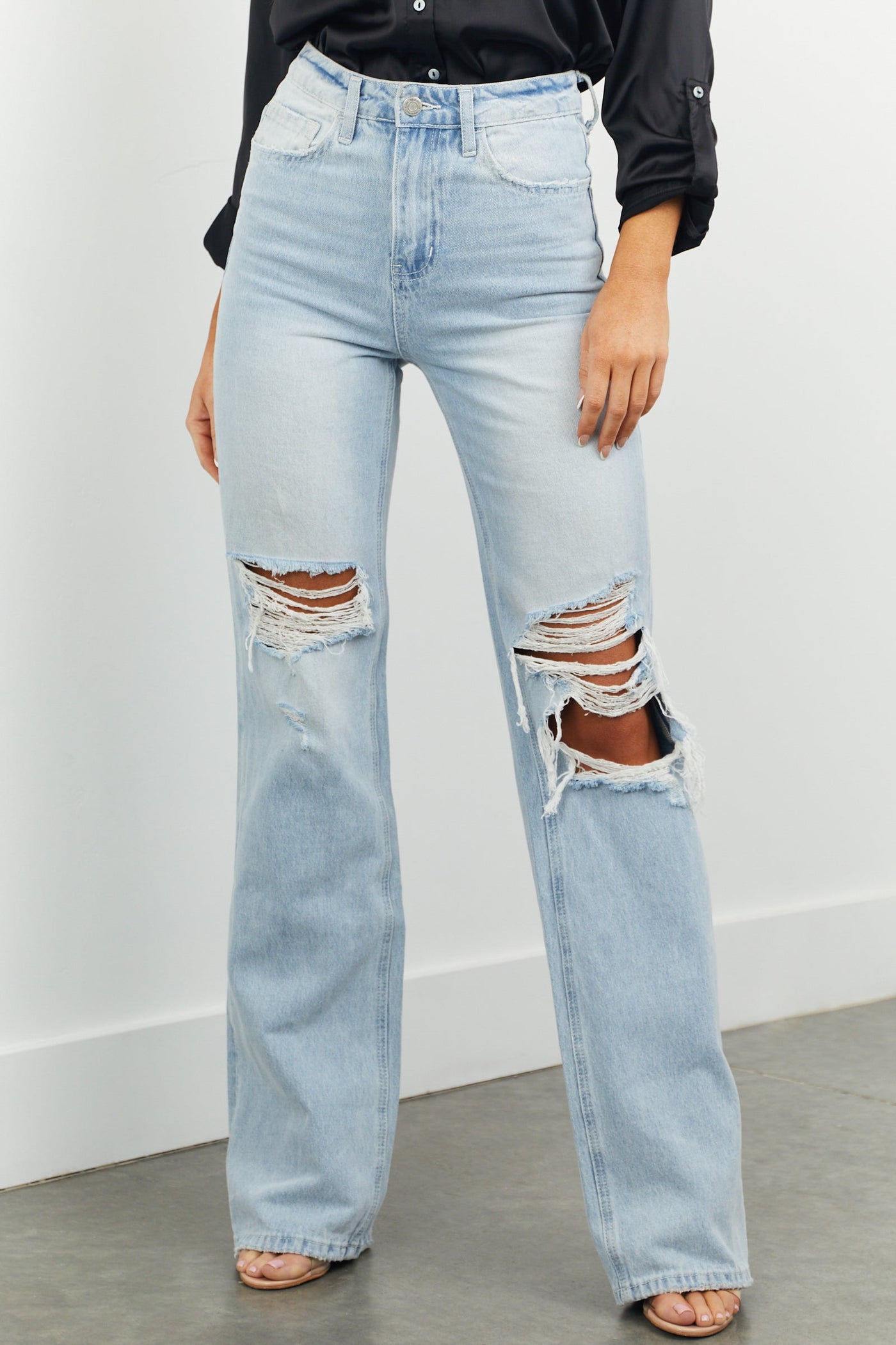 Light High Rise Heavily Distressed Flare Jeans