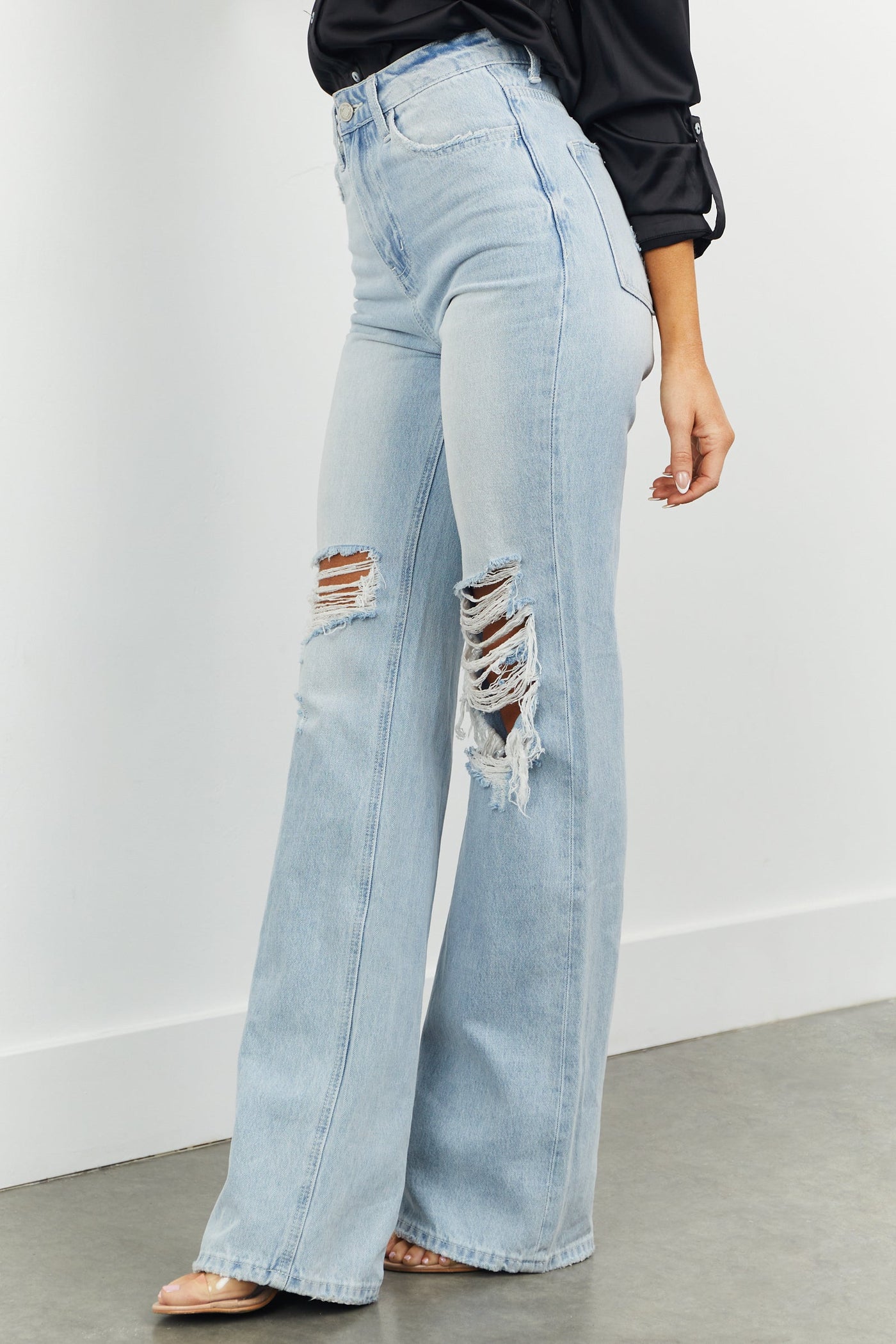 Light High Rise Heavily Distressed Flare Jeans