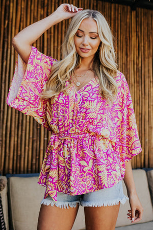 Magenta Printed Surplice Peplum Top with Waist Tie