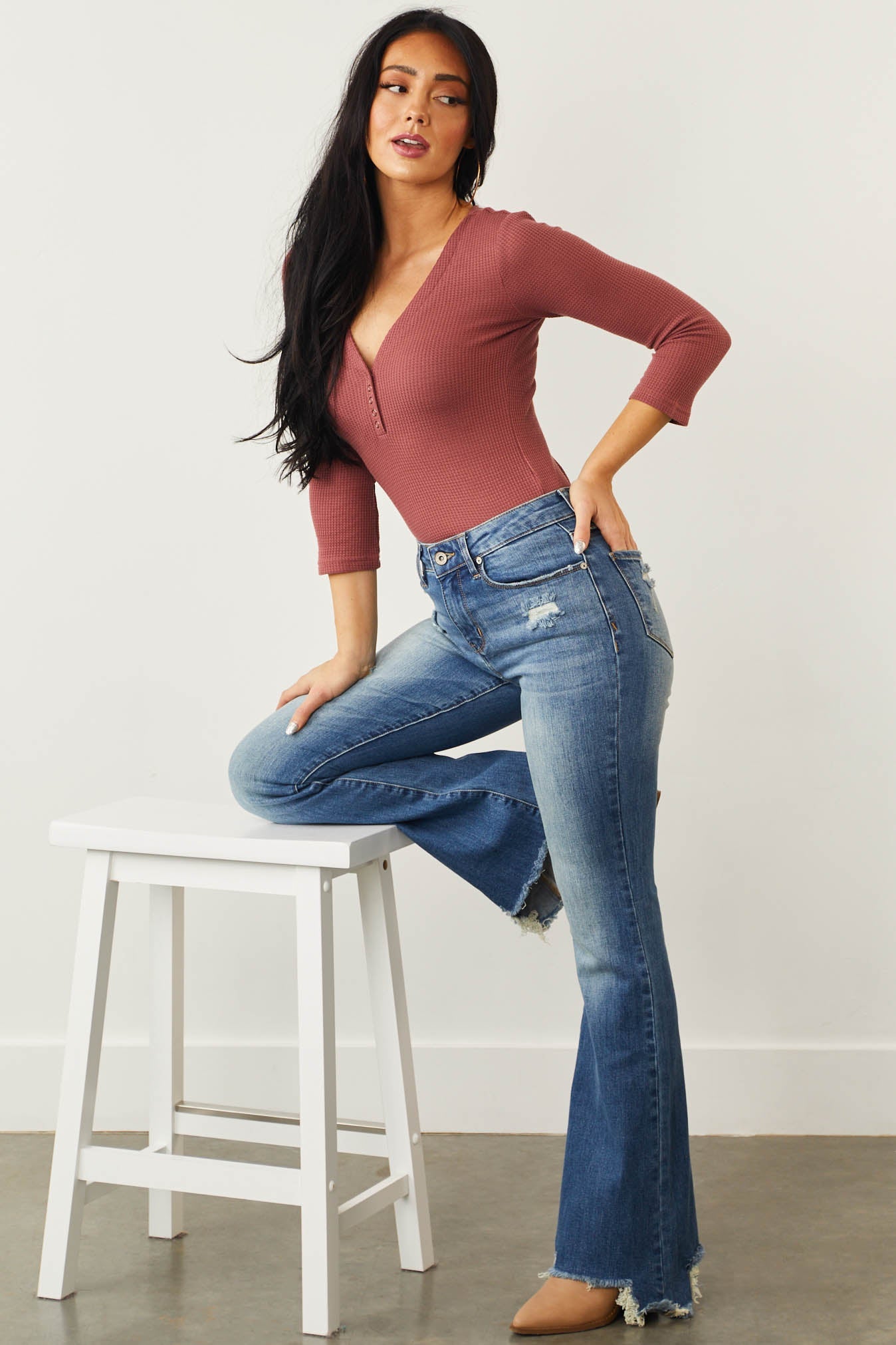 Medium Mid Rise Distressed Flared Jeans