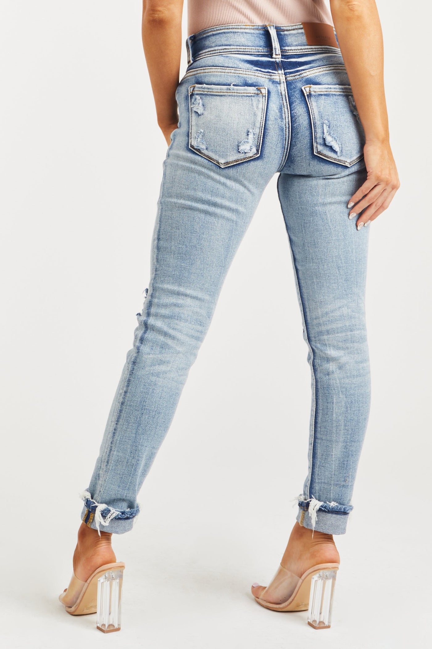 Medium Wash Mid Rise Distressed Knee Skinny Jeans