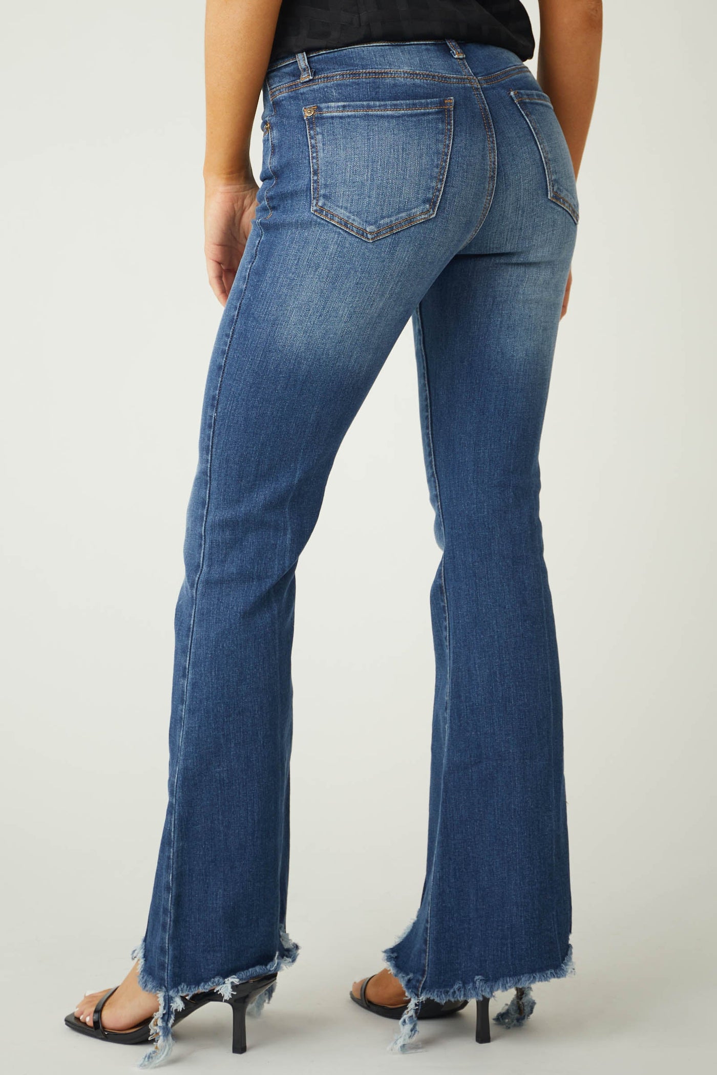 Medium Wash Mid Rise Flare Cut Raw Hem Jeans