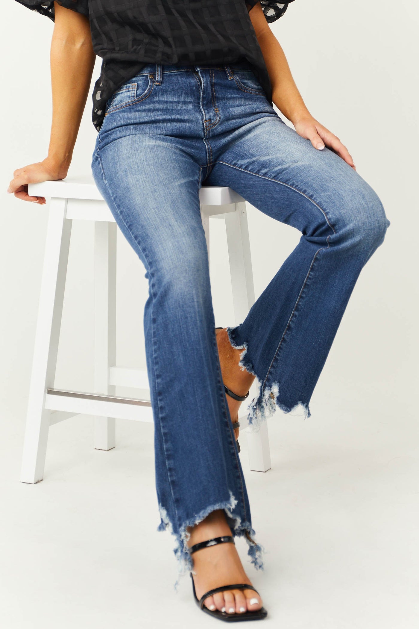 Medium Wash Mid Rise Flare Cut Raw Hem Jeans