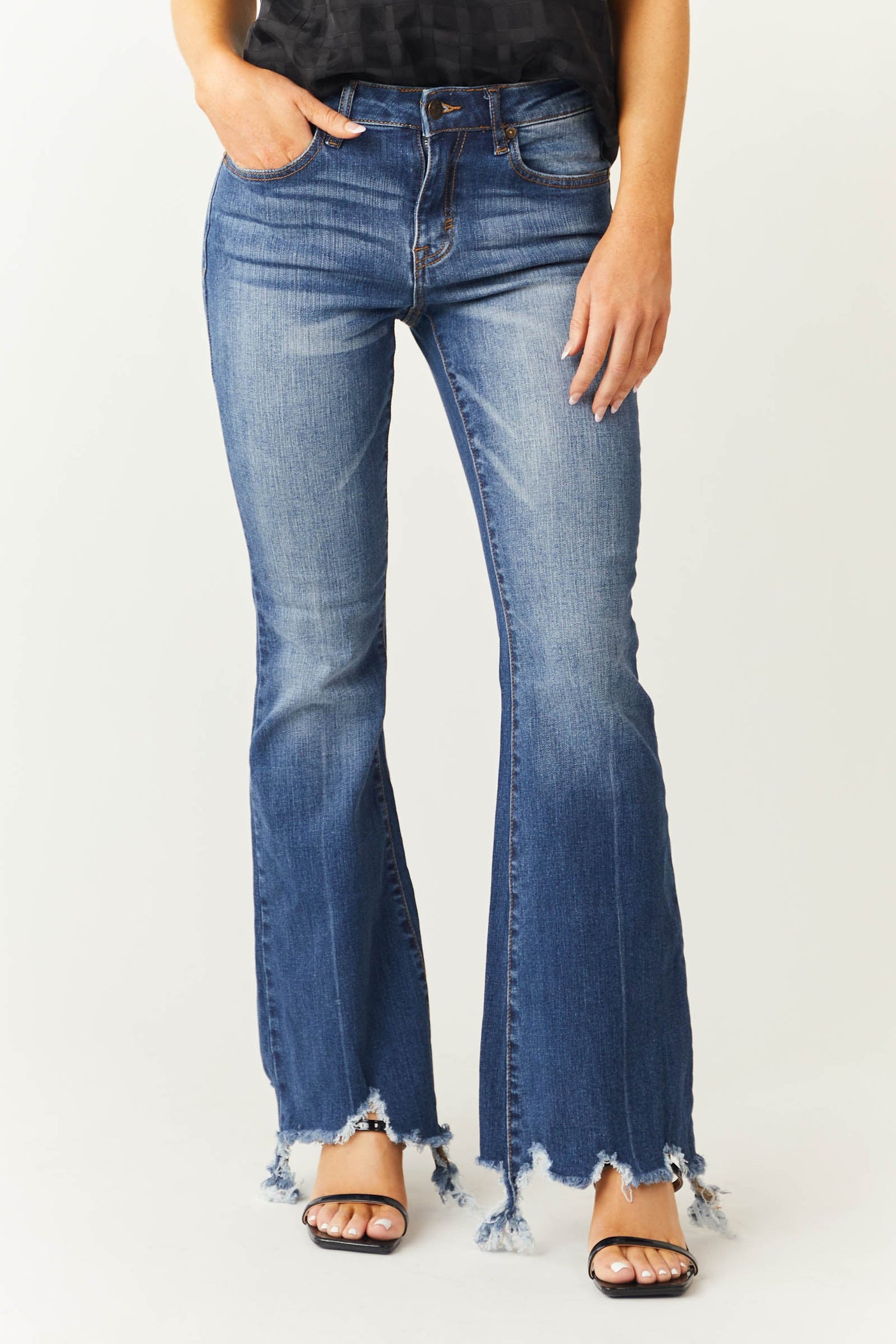 Medium Wash Mid Rise Flare Cut Raw Hem Jeans