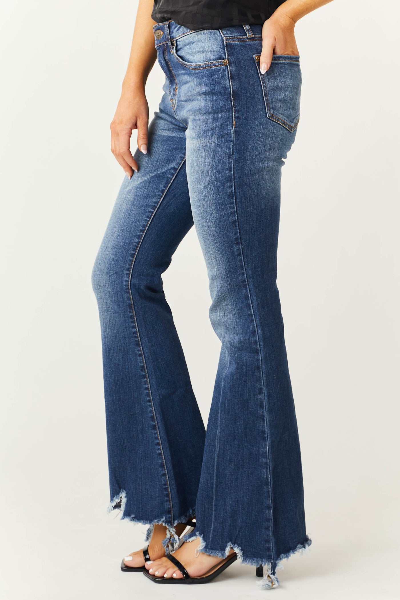 Medium Wash Mid Rise Flare Cut Raw Hem Jeans