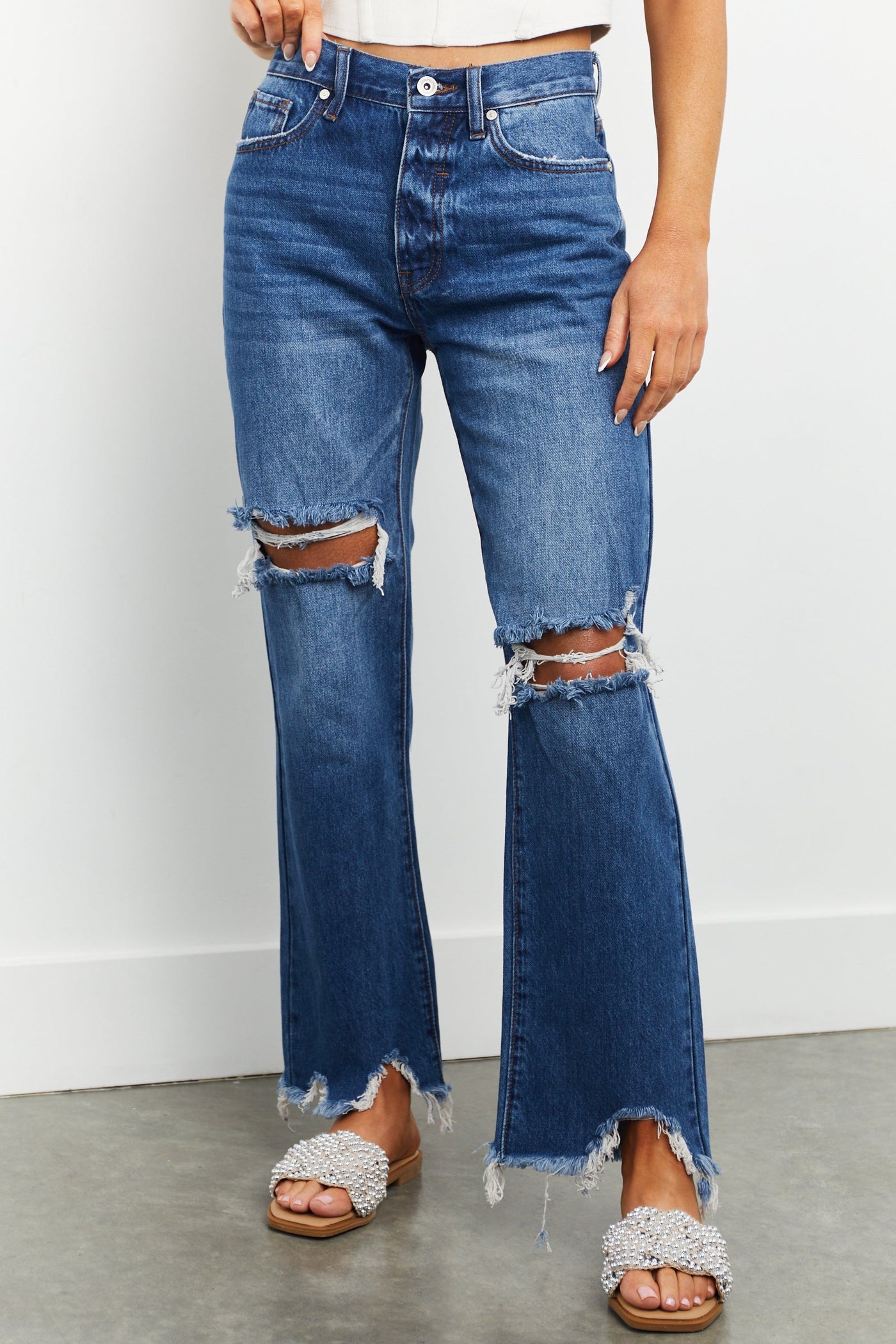 Medium Washed Shark Bite Hem Distressed Jeans