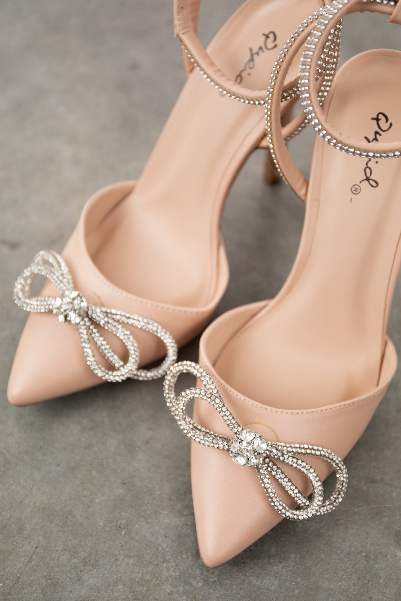 Nude Pleather Rhinestone Bow Pointed Heels