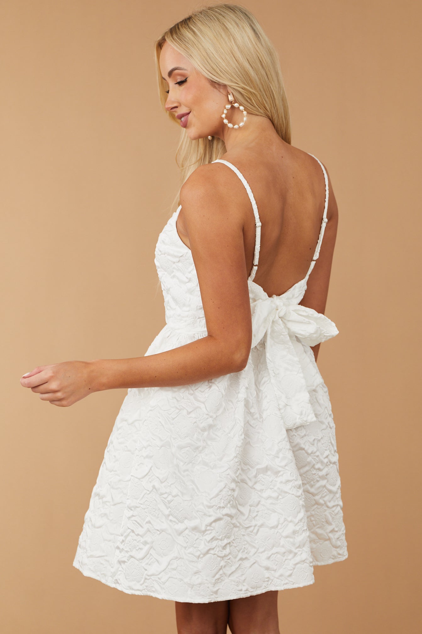 Off White Textured Sleeveless Open Tie Back Dress