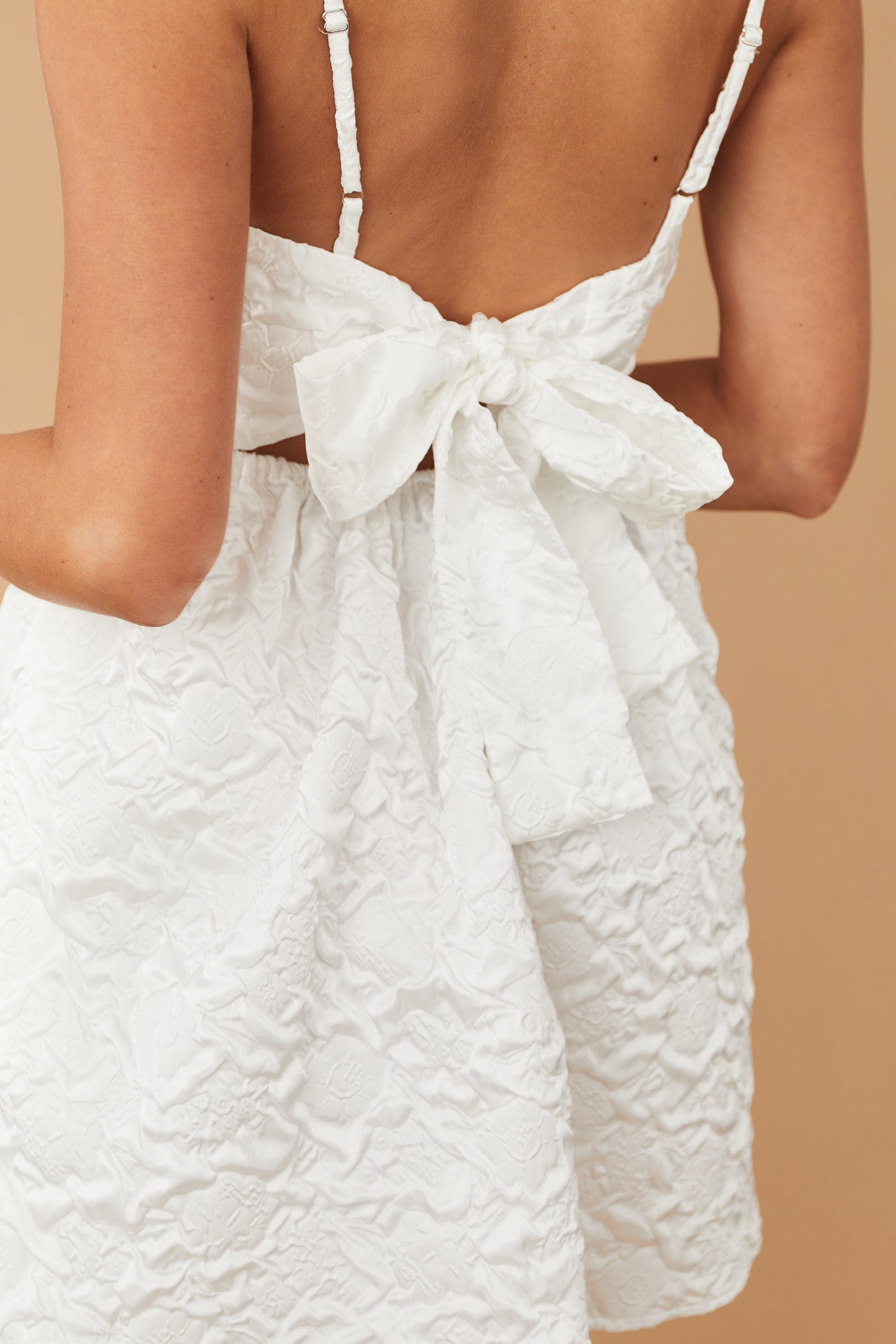 Off White Textured Sleeveless Open Tie Back Dress