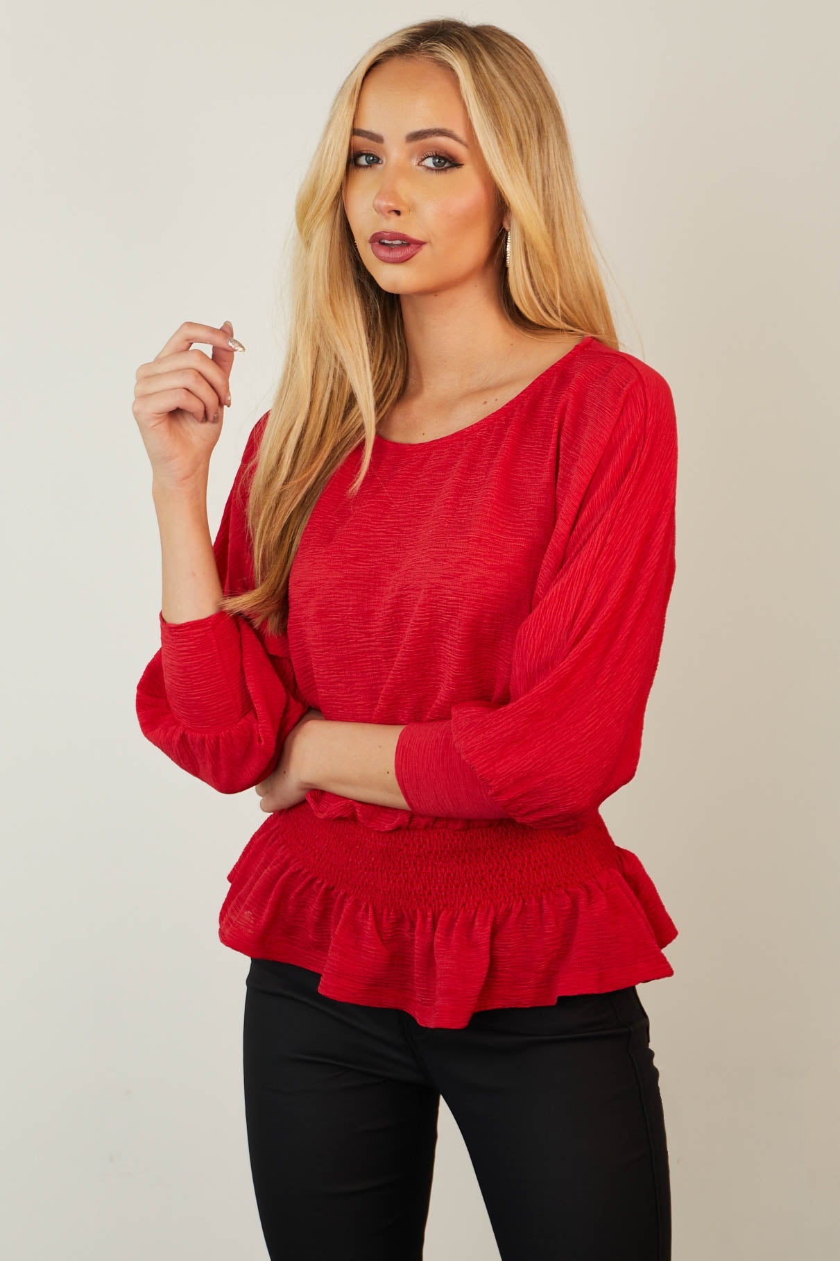Ruby Long Sleeve Smocked Peplum Knit Top