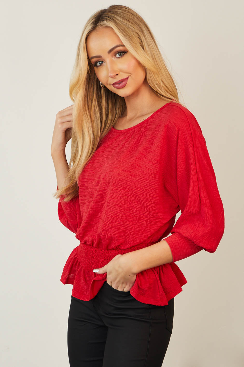 Ruby Long Sleeve Smocked Peplum Knit Top