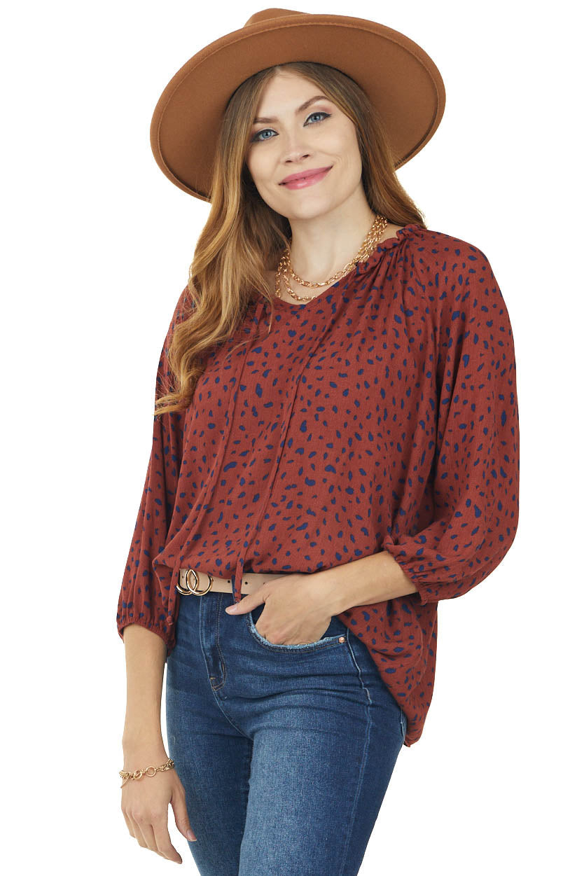 Rust Animal Print Bubble Sleeve Blouse