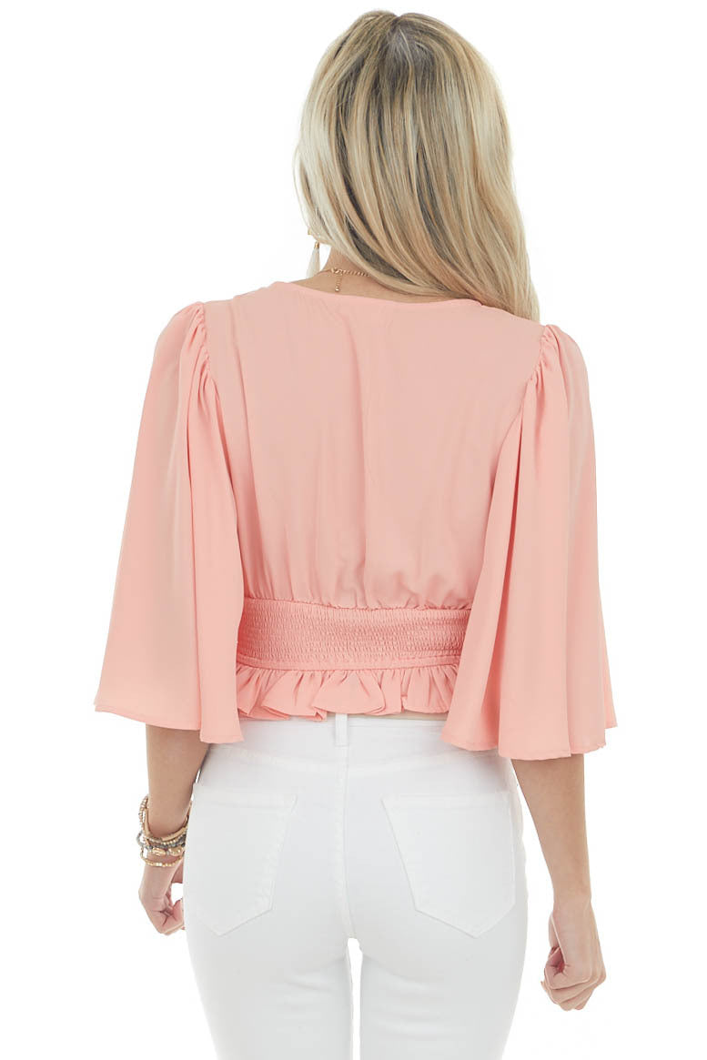 Coral Flutter Sleeve Smocked Peplum Blouse