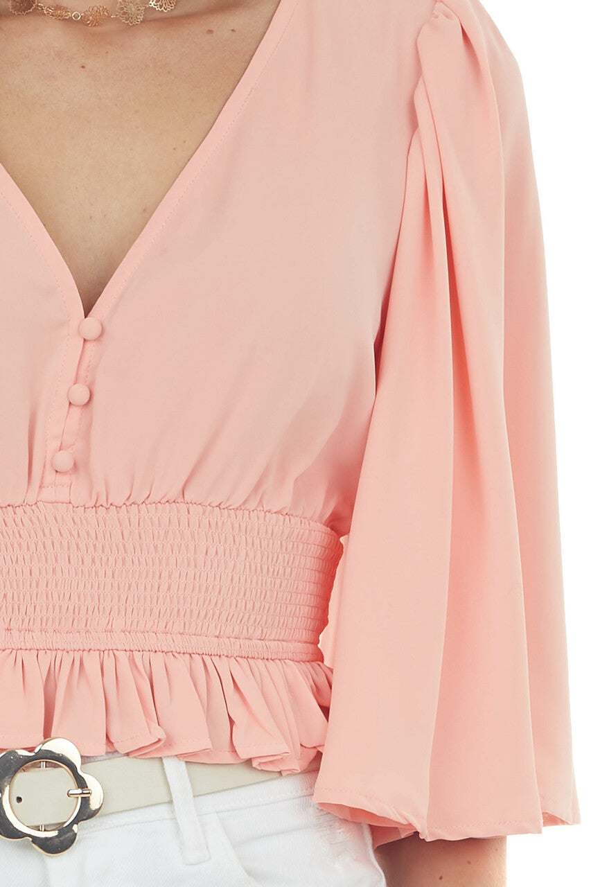 Coral Flutter Sleeve Smocked Peplum Blouse