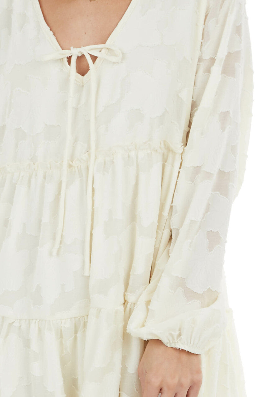 Cream Textured Print Tiered Babydoll Dress with Long Sleeves