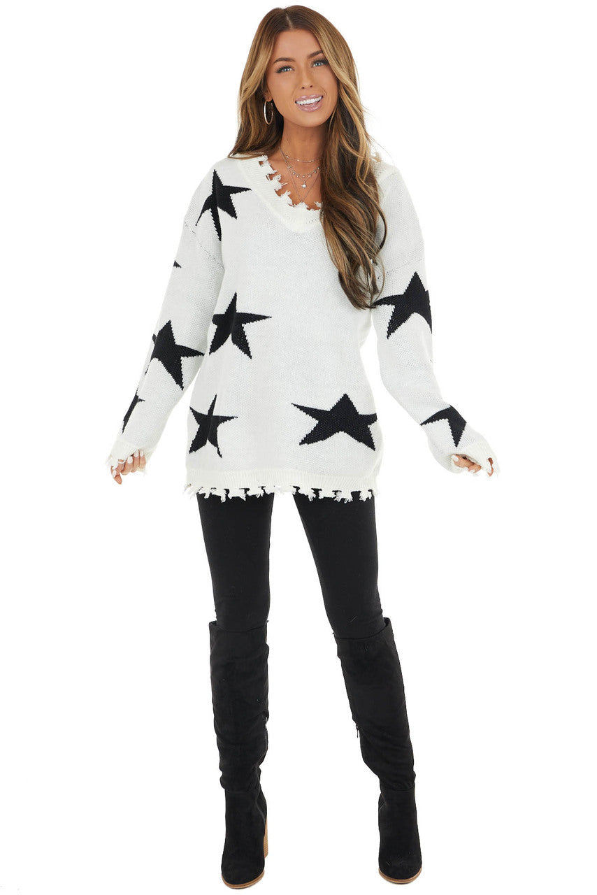 Ivory and Black Star Print Sweater Top with Fringe Detail