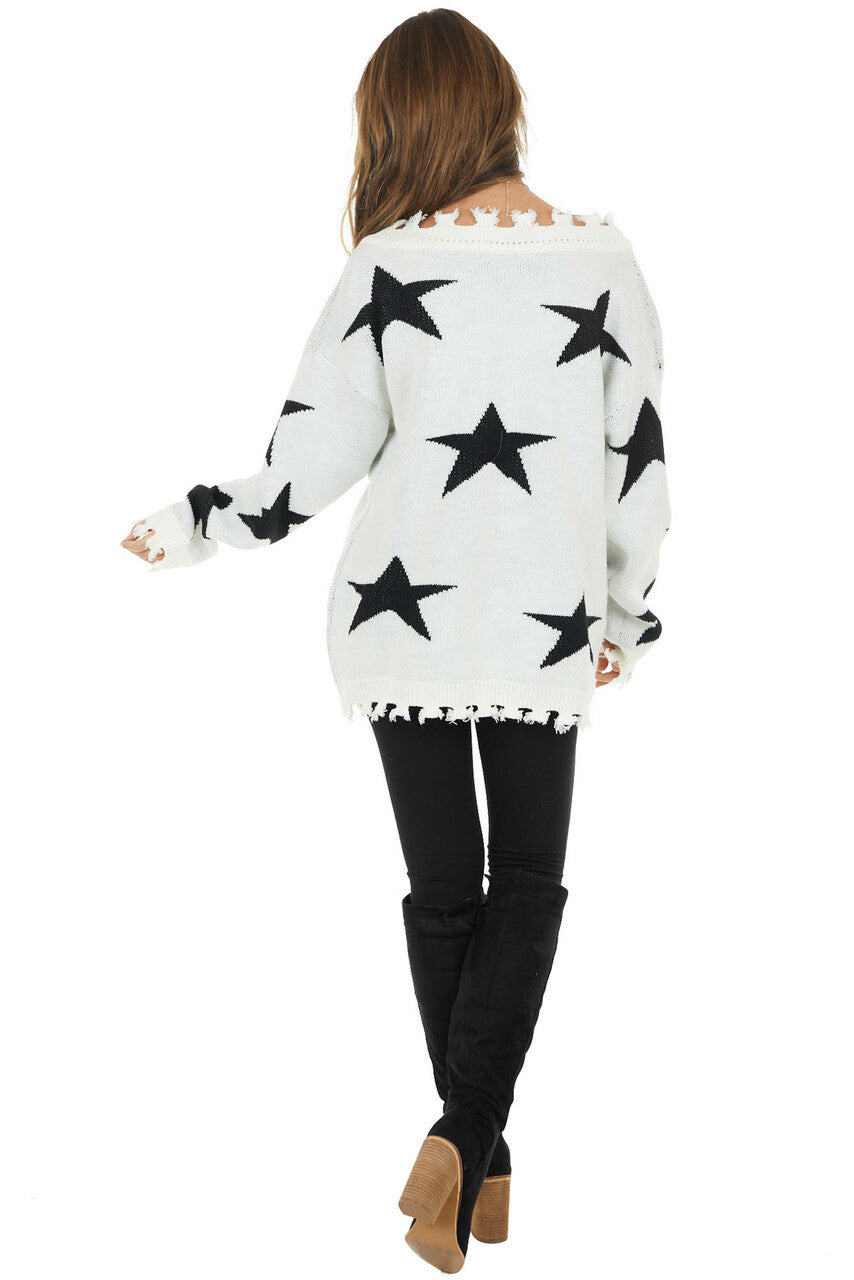Ivory and Black Star Print Sweater Top with Fringe Detail