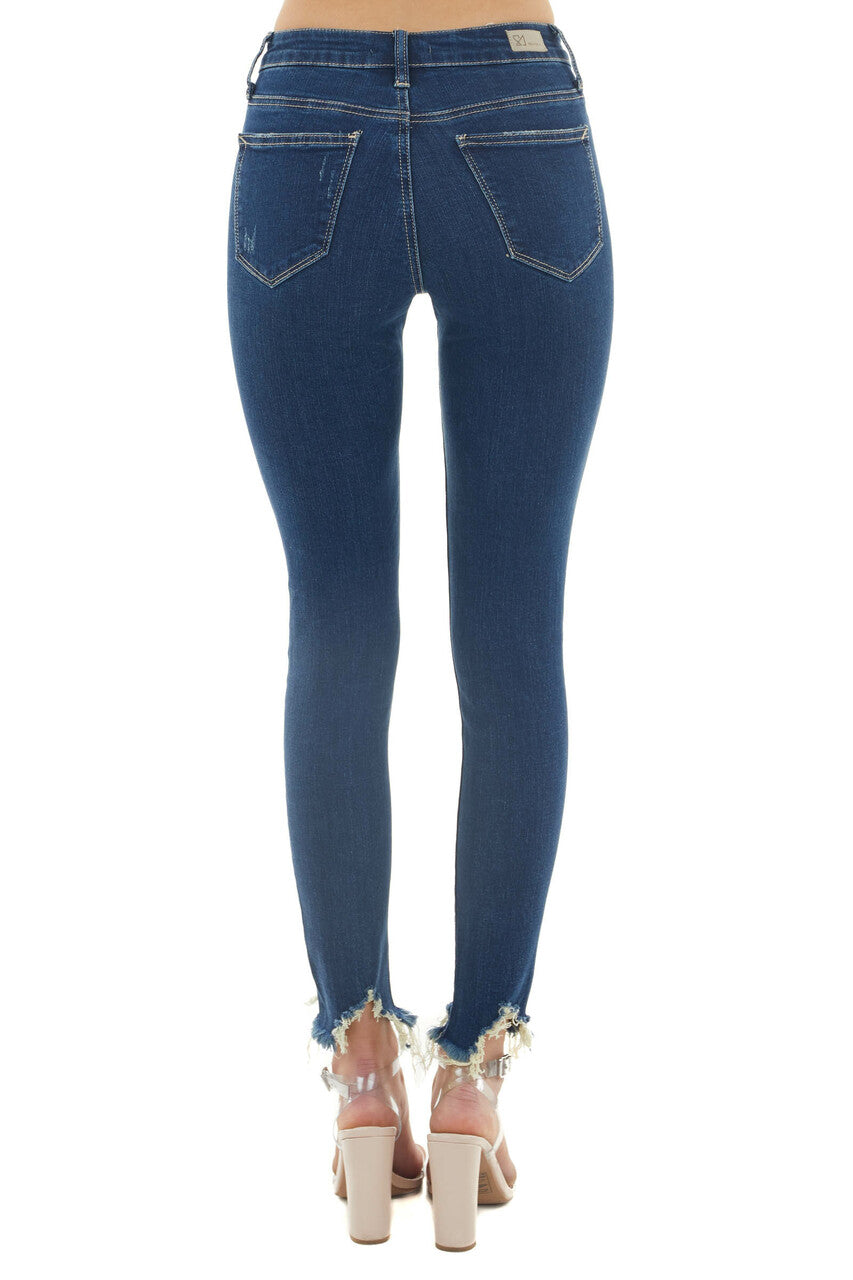 Medium Dark Wash Mid Rise Skinny Jeans with Shark Bite Hem