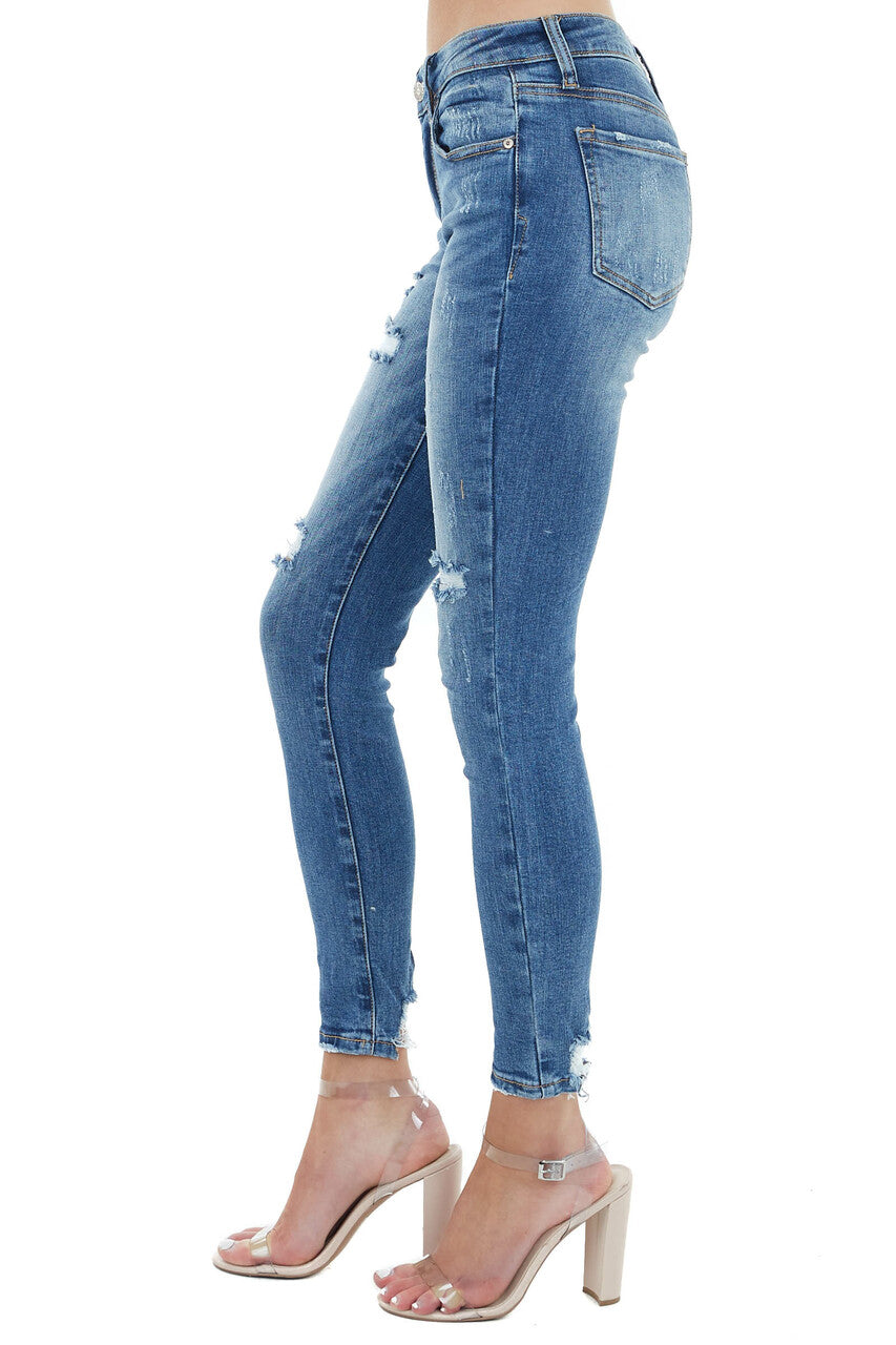 Medium Wash Mid Rise Skinny Jean with Light Distressing