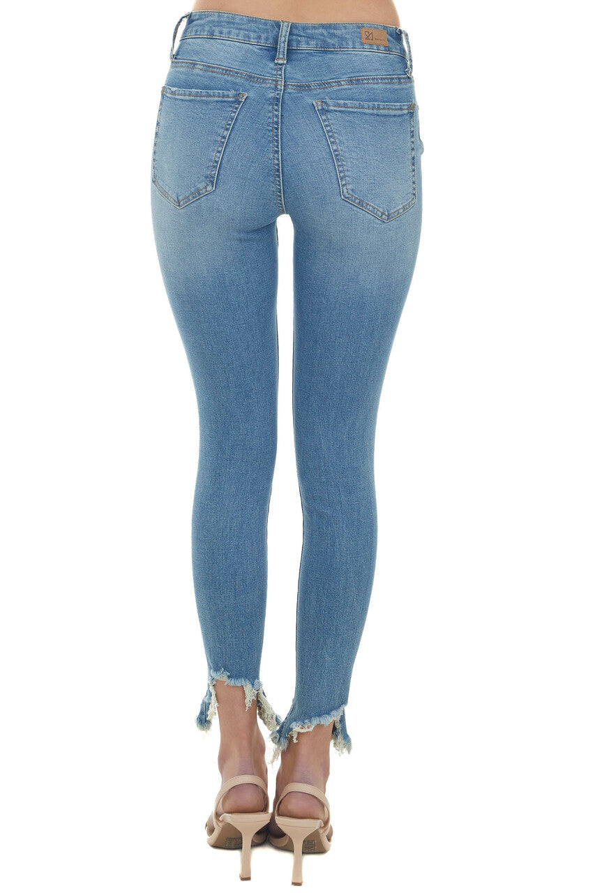Medium Wash Ripped Hem Mid Rise Skinny Jeans