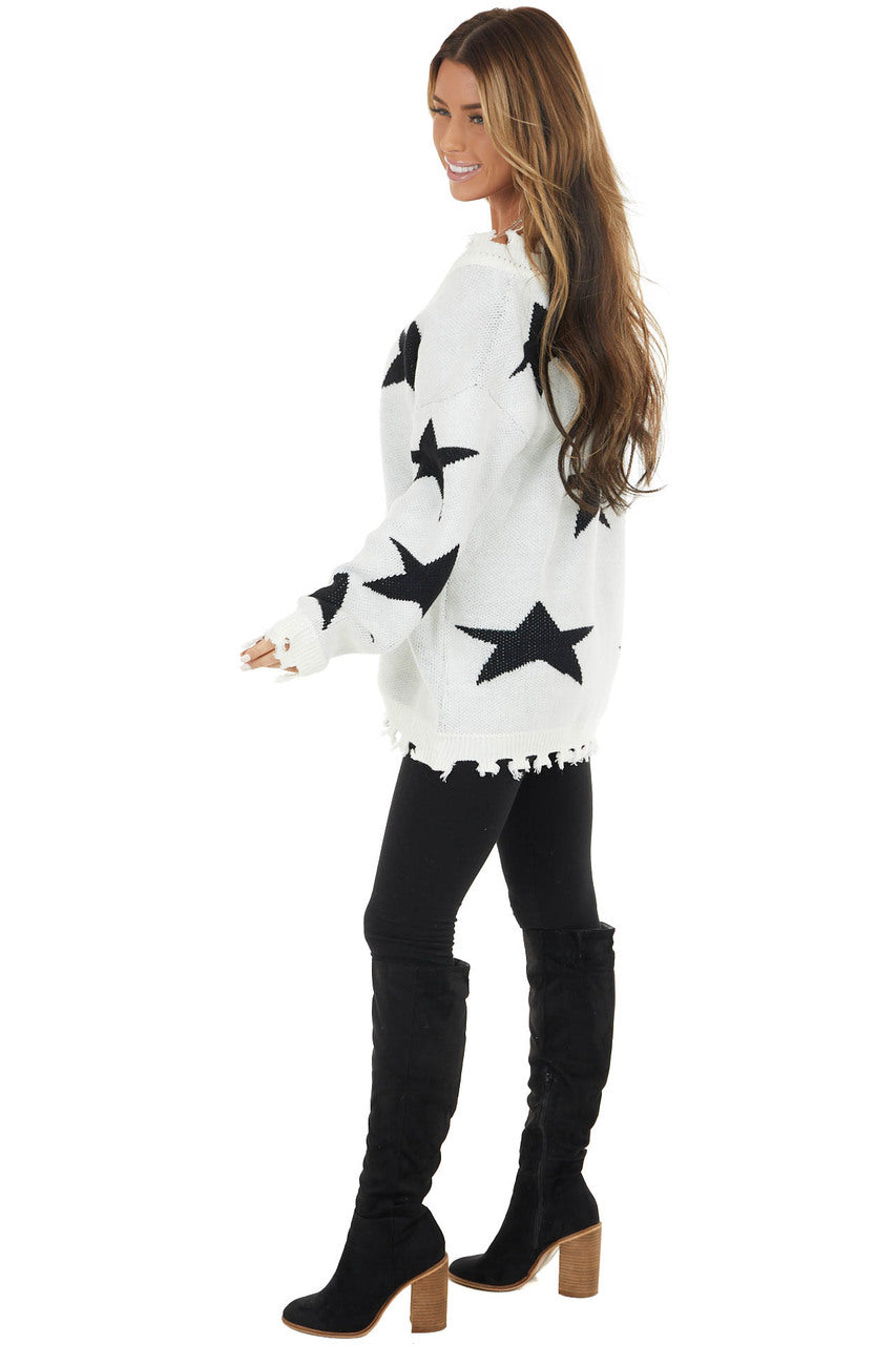 Ivory and Black Star Print Sweater Top with Fringe Detail