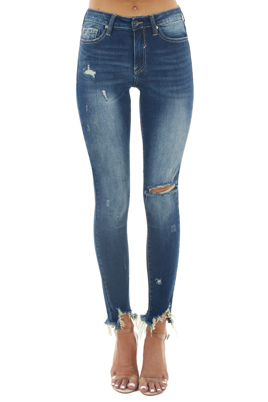 Medium Dark Wash Mid Rise Skinny Jeans with Shark Bite Hem