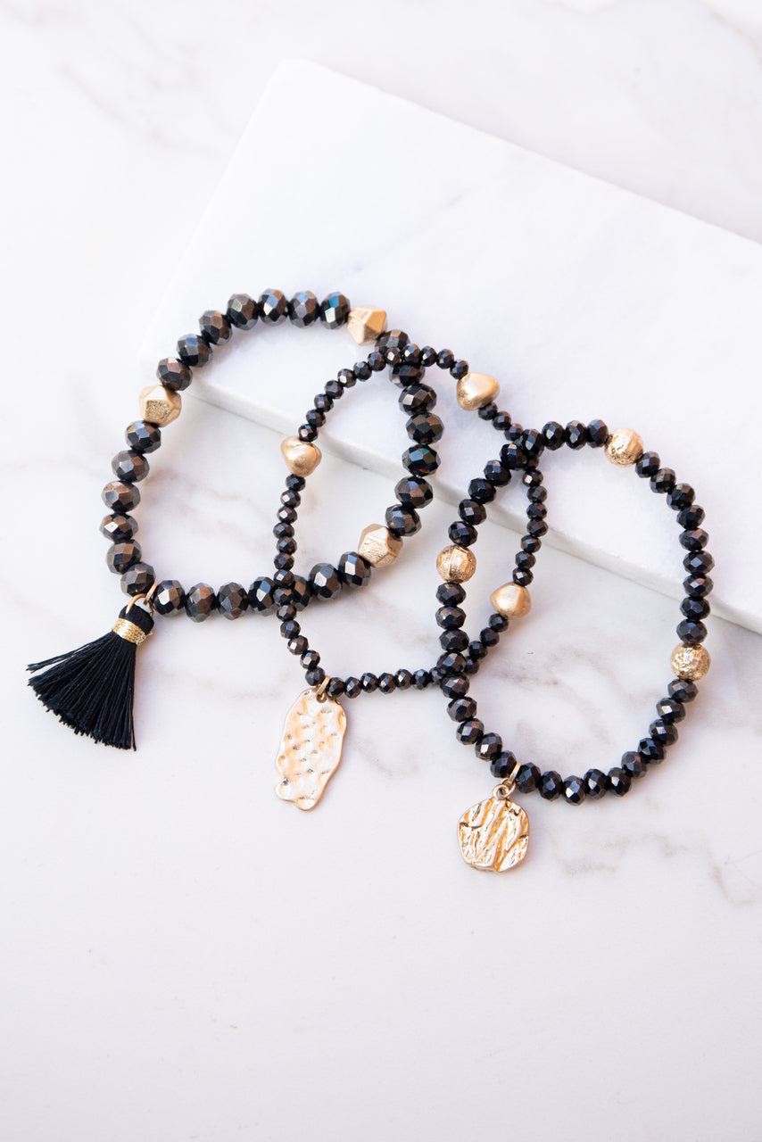 Black and Gold Beaded Bracelet Set with Tassel and Charms