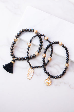 Black and Gold Beaded Bracelet Set with Tassel and Charms