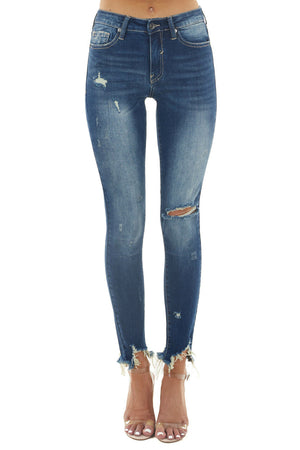 Medium Dark Wash Mid Rise Skinny Jeans with Shark Bite Hem