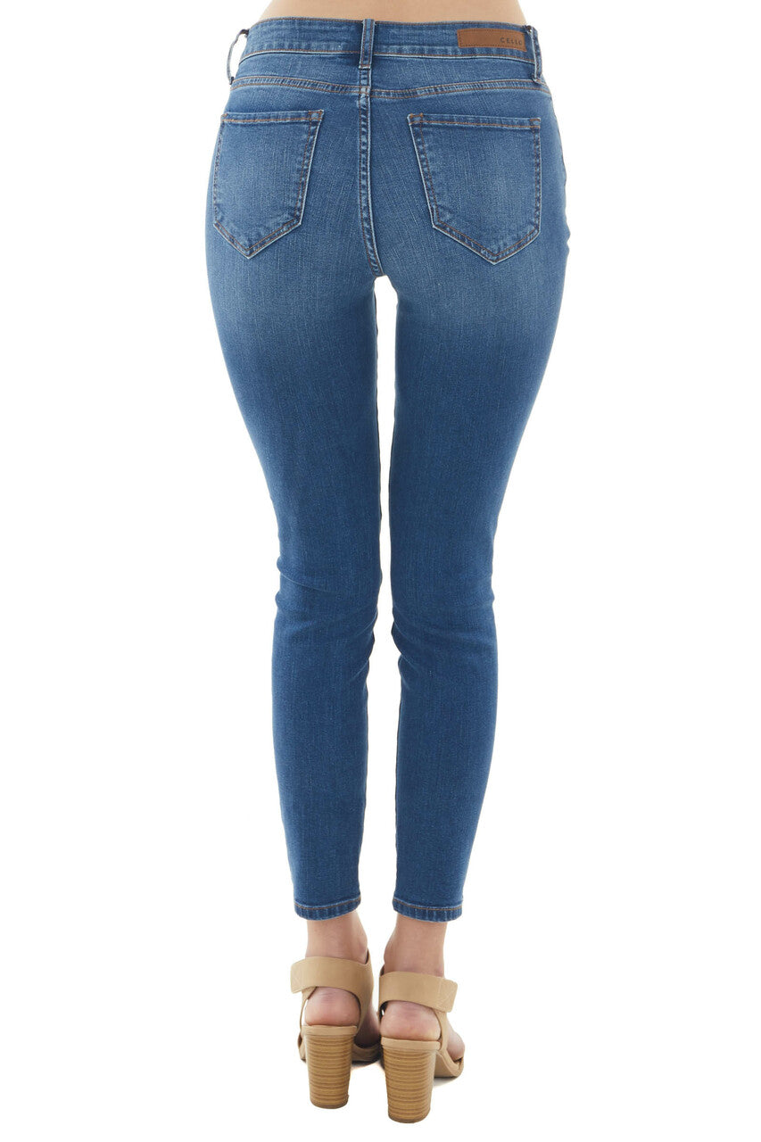 Medium Mid Rise Distressed Knee Skinny Jeans