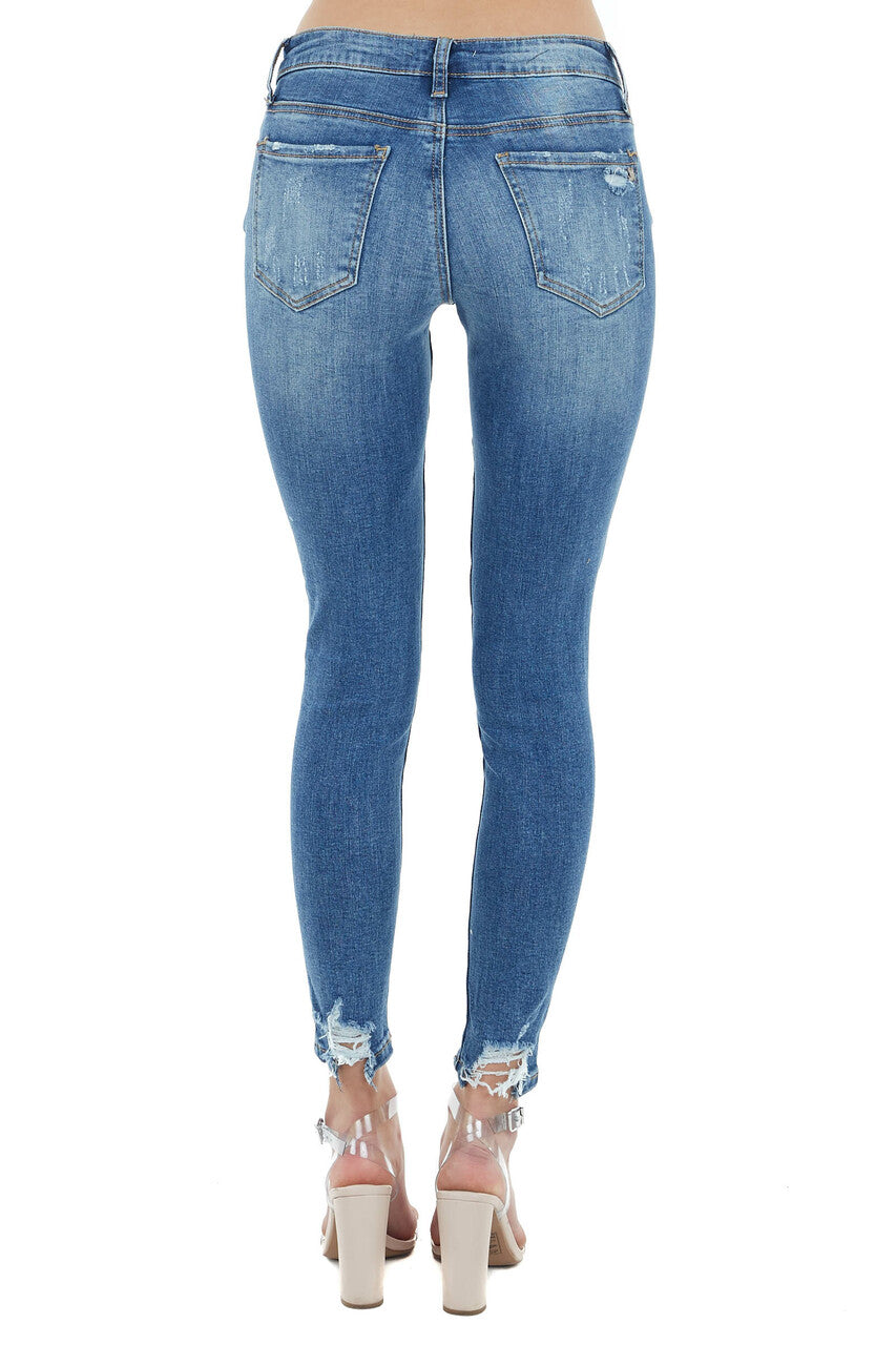 Medium Wash Mid Rise Skinny Jean with Light Distressing