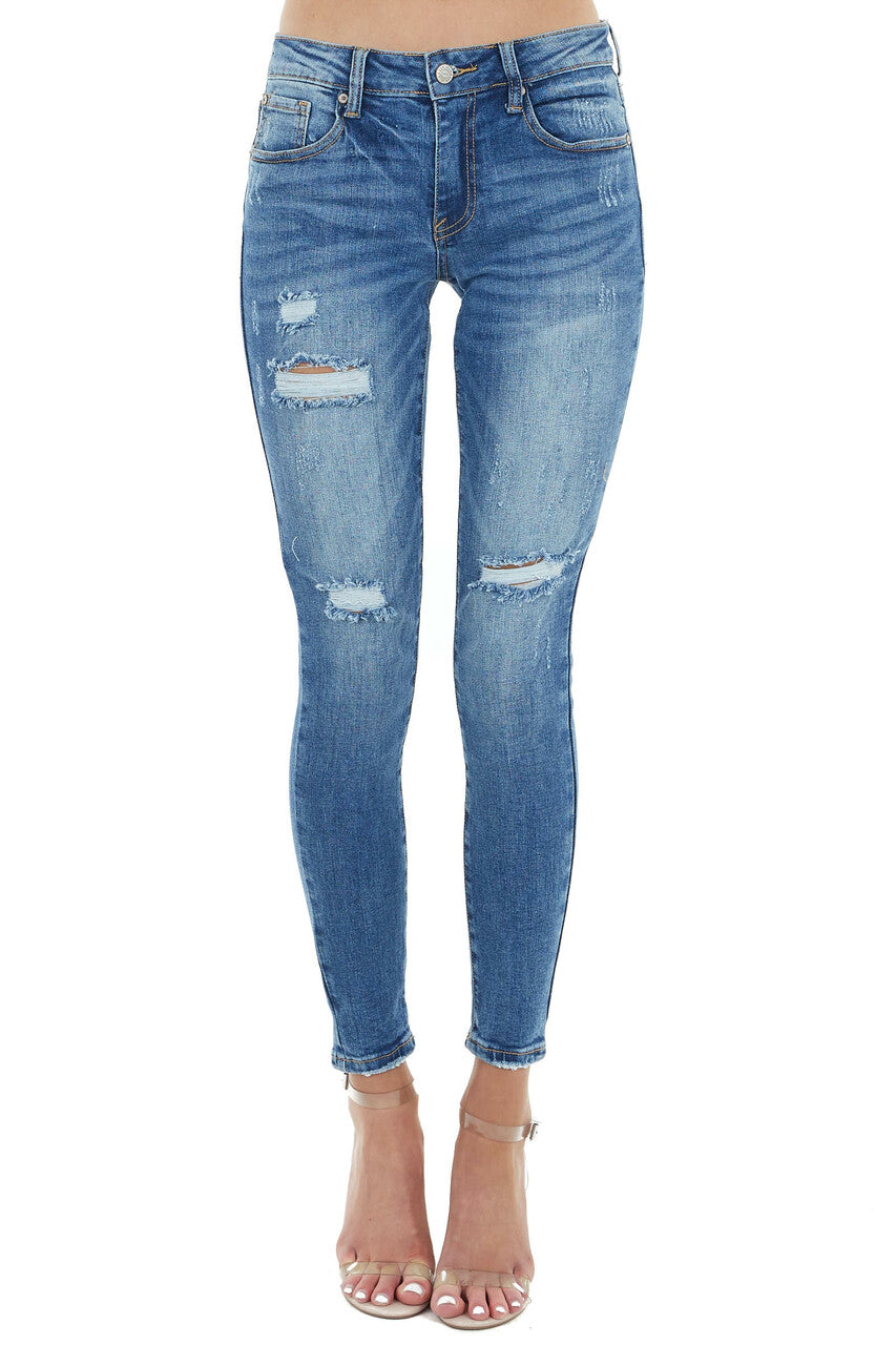 Medium Wash Mid Rise Skinny Jean with Light Distressing