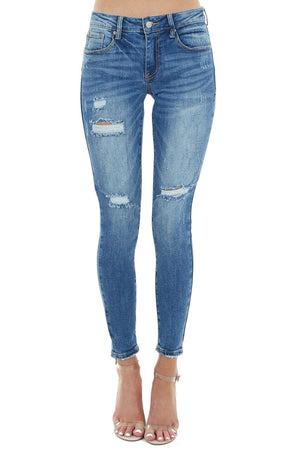 Medium Wash Mid Rise Skinny Jean with Light Distressing